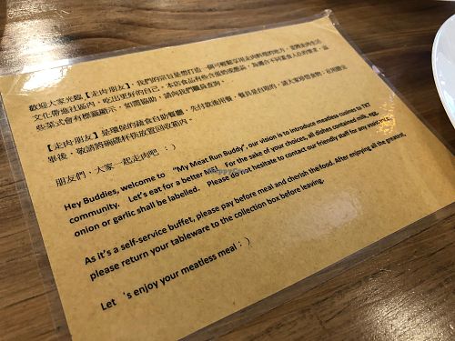 Restaurant info on the table at Simple me 素來素往 in Kowloon