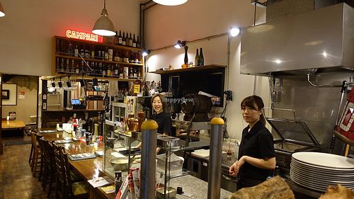 Friendly staff and restaurant interior at Bambino in Niigata