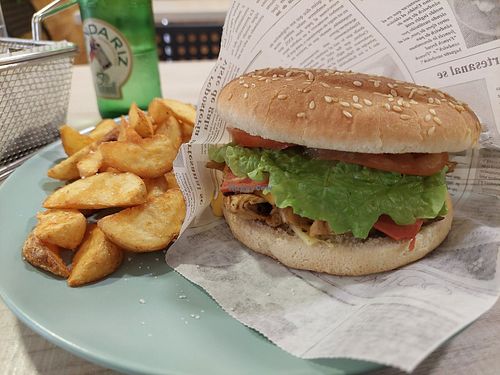 No-pollo burger (heura pb chickn sandwich) and potato wedgess at Veggie Burger in Vigo