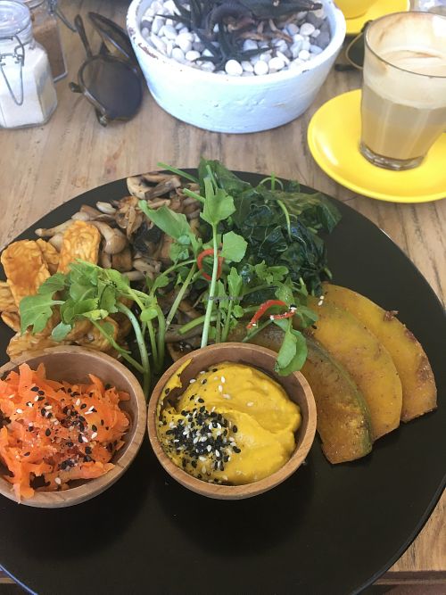 Build your own meal - BBQ tempeh, sautéed spinach and mushrooms, roasted pumpkin, fermented carrot, and turmeric hummus. at Two Trees Eatery in Tibubeneng