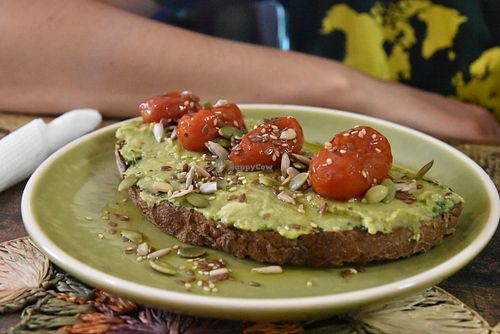 Tartine with avocado, cherry tomato and pesto at Dona Flor Cafe in Lisbon