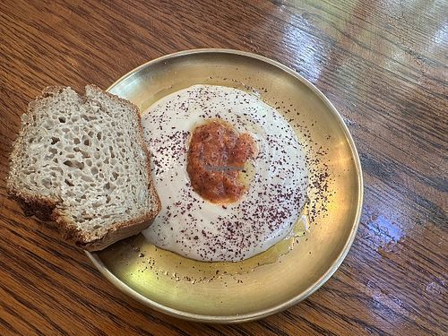 Starter - tahini with tomato.   at Meshek Barzilay Deli in Tel Aviv
