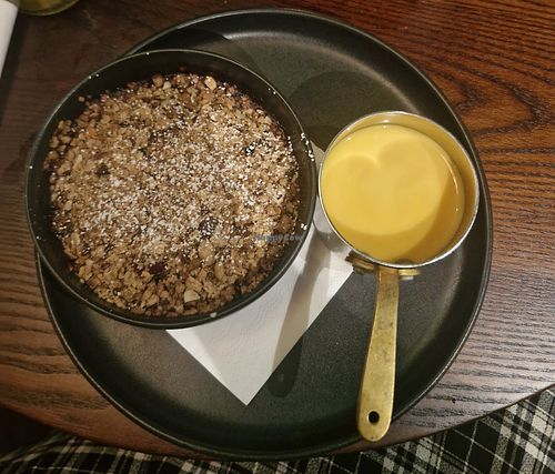 RHUBARB & SOUR CHERRY CRUMBLE (VE)
Granola crumb, vegan custard at The Merlin in Alderley Edge
