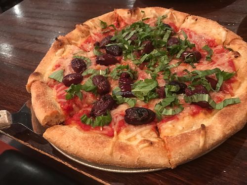 10 inch vegan cheese, Greek olives and basil pizza : ) at Tomato Bar Pizza Bakery in Valparaiso