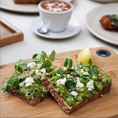 Vegan Smashed Avo - tofu feta, herb salad, super seeds with chilli olive crumb at The Resident Cafe in Ashburton