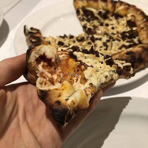 Pizza Napolitaine avec extra viande hachée (croûte avec extra fromage) at Vegan Rapide - Le Misanthrope in Montreal