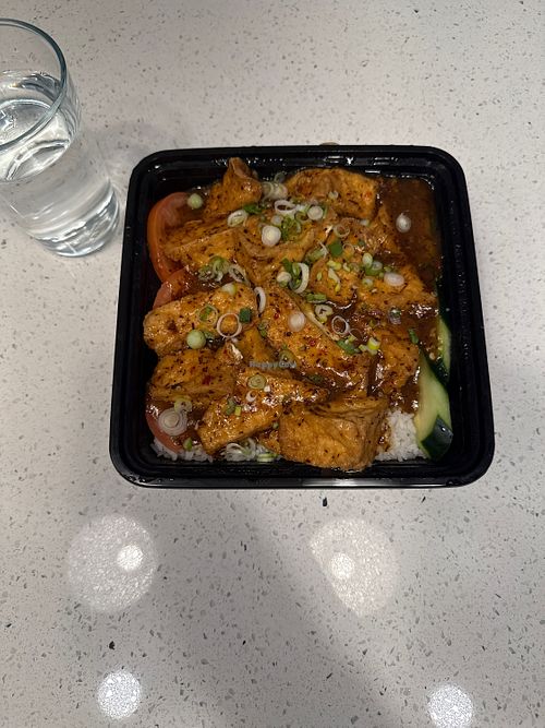 Lemon grass tofu (vegan) with many other vegan by request listings. Glass for scale (huge portion). Tofu is fried and flavor is subtle but great    at La-Cai Noodle House in Salt Lake City