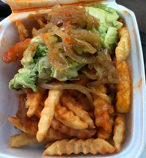 Buffalo fries topped with grilled onions and avocado  at Shake 'N Buns in Bakersfield