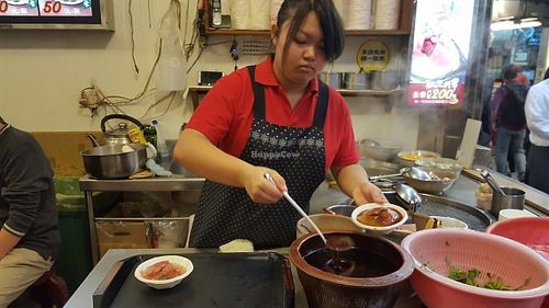 Black sweet sauce added to Red Vinasse Taiwanese Meatballs before serving at JinZhi Hong Zao Su Rou Yuan in New Taipei City