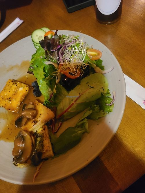Tofu steak with mushroom sauce (half eaten because I forgot to take a picture when it first came out) at Soy  in Rosendale