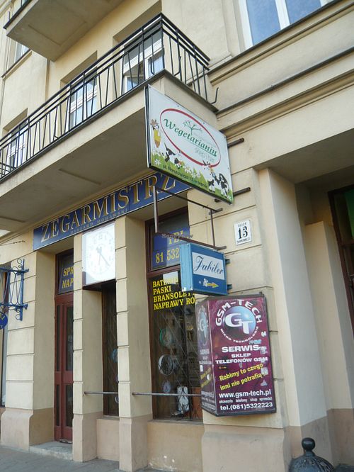 the sign from the street at Wegetarianin Bar Sklep in Lublin