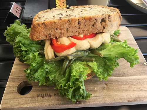 Three slices of bread with veggies and humous at Fru Geest in Aabenraa