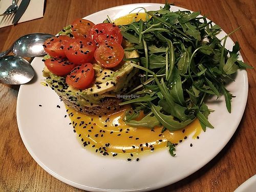 Avocado and quinoa tartare with cherry tomato, arugula (rúcula) and sweet reductions. at Hakuna Matata Veggie in Madrid