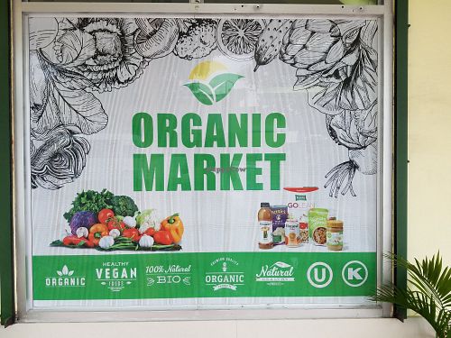 Signage at Organic Supermarket Pura Vida in Quepos