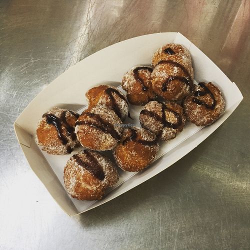 Our vegan donuts drizzled in dark chocolate  at V Kitchen - Food Stall in Hull