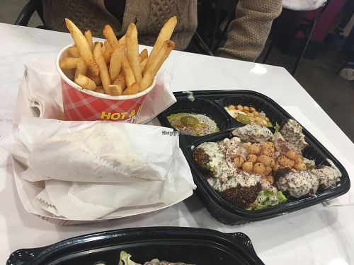 Spicy falafel plate with extra pita and side of fries  at Yassin's Falafel House - N Peters Rd in Knoxville