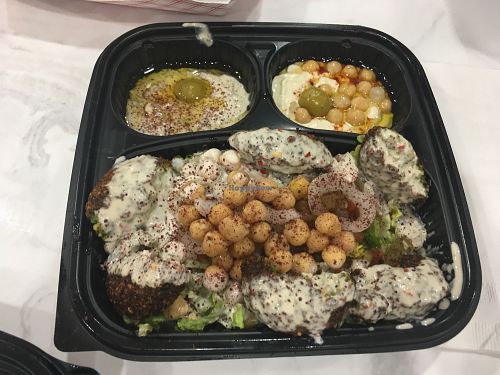 Spicy falafel plate: falafel salad, hummus, baba ganoush, and pita bread  at Yassin's Falafel House - N Peters Rd in Knoxville