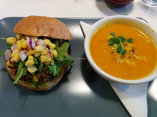 California Burger topped with corn salsa and arugula, with carrot ginger soup of the day at Sprout in Nelson