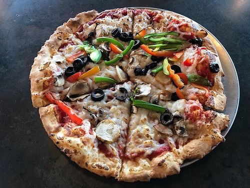 Build your own all-vegan "your pie" with crispy artisan thin crust, marinara sauce, daiya vegan cheese, black olives, mushrooms, and red and green peppers. at Pie Five Pizza in Frederick