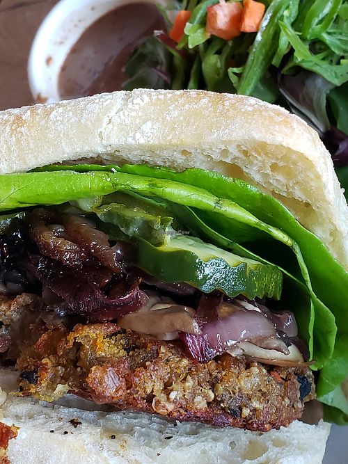 American burger w/ toppings of pickles, lettuce, mushrooms and grilled onions. at Hugo's Restaurant - Studio City in Studio City