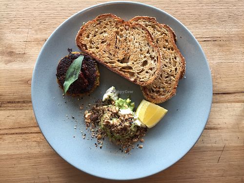 Meal of sides: sourdough toast with smashed avo, almond feta and dukkha as well as a sweet potato and coconut fritter with chilli jam at Small Graces in Footscray