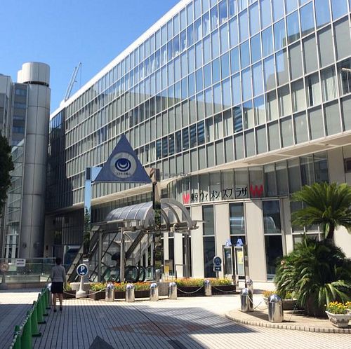 go down the escalator under the blue triangle  at The Biokura Cafe in Tokyo