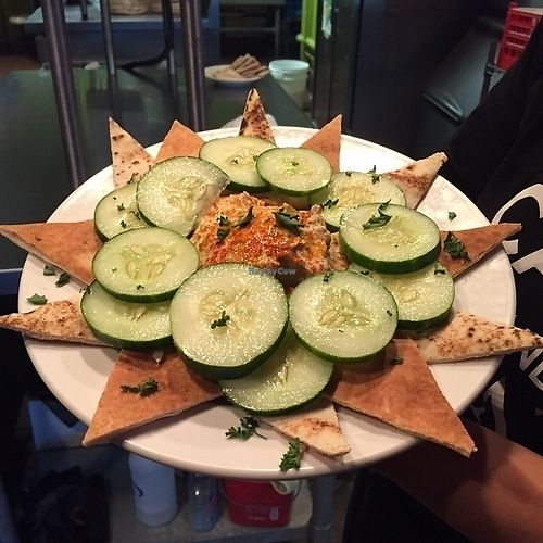 Hummus add cucumbers at Eat a Pita in Louisville