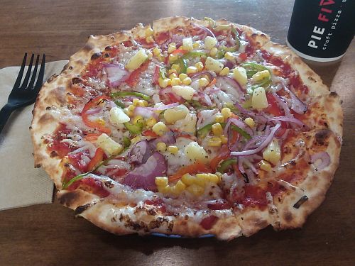 Thin crust pizza with vegan cheese, pineapple, onion, peppers, and corn. Chose my own toppings. at Pie Five Pizza in Estero