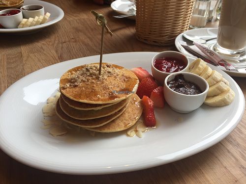 Vegan pancakes with strawberries and chocolate hazelnut.  at Bhajan Cafe in Krakow