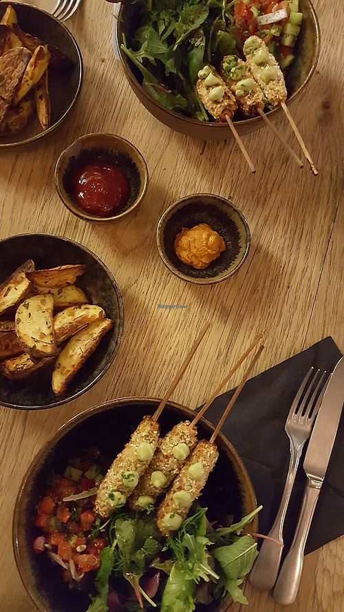 Vegan skewers with tasty salad, potato wedges and dips at De Markten Cafe in Brussels