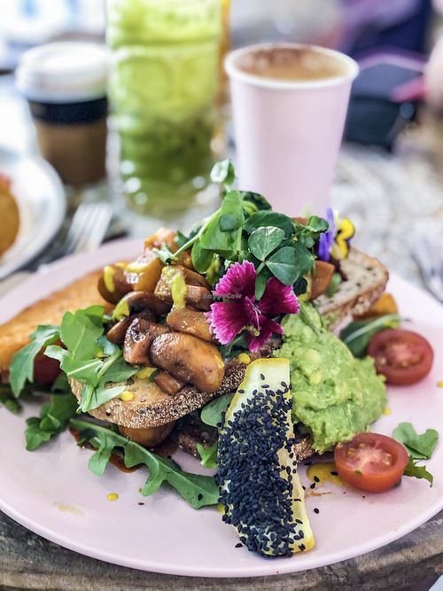 “Vegan love” (smoked mushrooms, pumpkin, spinach, on sourdough with cashew cheese and a hash brown)  at Pier B Wholefood Cafe in Hope Island