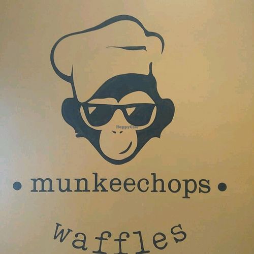 Logo on wall at Munkeechops Gafe in Brighton