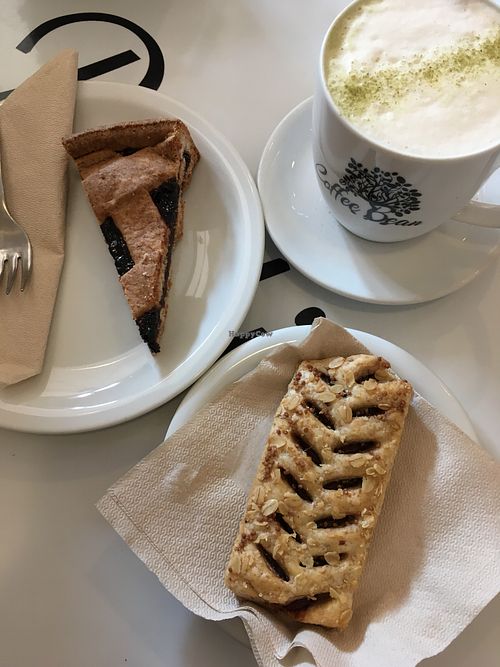Vegan breakfast with soy matcha latte, berry tart and hazelnut pastry  at Coffee Bean in Bolzano