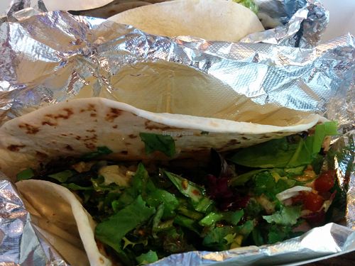 Veggie Taco - Good eating hot or cold! Mushrooms, black beans and rice, lettuce, peppers, onions, cashew cheese on a flour tortilla. at Dellz On The Macon in North Charleston