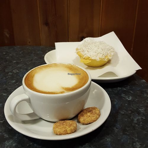 Oat milk latte and Bakewell tart at Coughlans Bakery - Reigate in Reigate