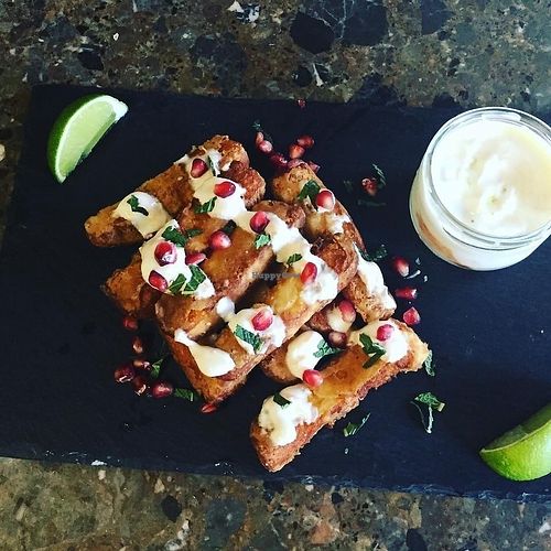 Halloumi frites with harissa yoghurt, fresh mint and pomegranate seeds  at Beans and Greens in Whitehaven