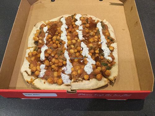 The “Crunchy Indian” Pizza - creamy masala sauce, roasted chickpeas, mango chutney and mint soy yoghurt at Beans and Greens in Whitehaven