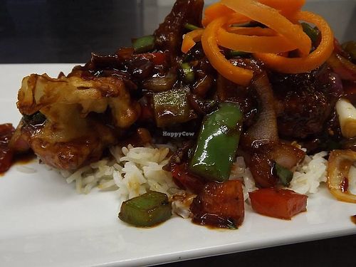 Gobi Manchurian (breaded cauliflower) over basmati rice. at Gloria's Restaurant in Sudbury