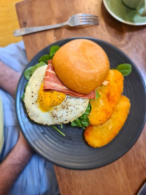 Egg and bakon roll with hashbrowns at One for the Crow in Maidstone