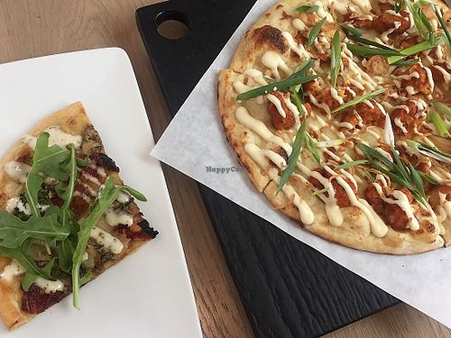 A slice of Pesto CBR and Stranger Wings. Both good! at Virtuous Pie - UBC in Vancouver