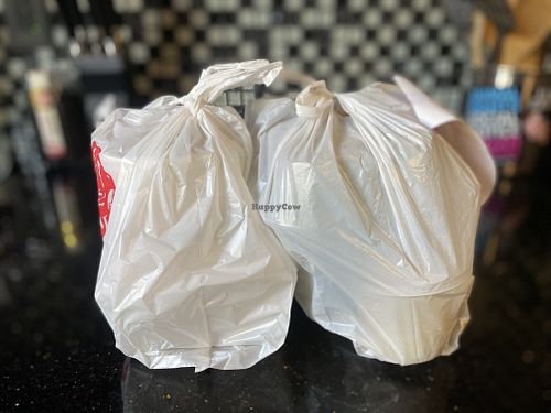 Complete Order in Thin Plastic Bags Knotted 😭  at Merit Vegan Restaurant in Sunnyvale