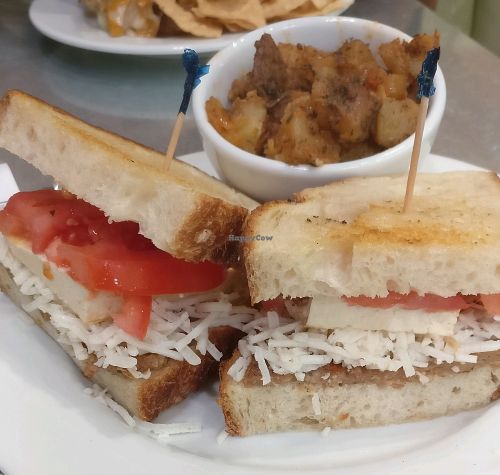 mother's melt: vegan cheese, sausage, tofu, with side of potatoes at Mother's Market Kitchen in Signal Hill