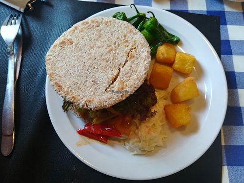 vegan burger with patatas, padrones, coleslaw and pepper at El Estragon Vegetariano in Madrid