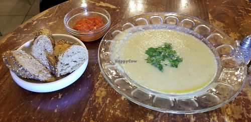 Lentil soup, bread and tomato sauce at Imbala in Jerusalem