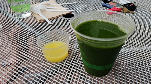 mean green juice and ginger shot at Superfood Bar in Denver