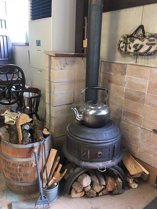 Wood stove. So warm and cozy. at Cafe Bonte in Tanabe
