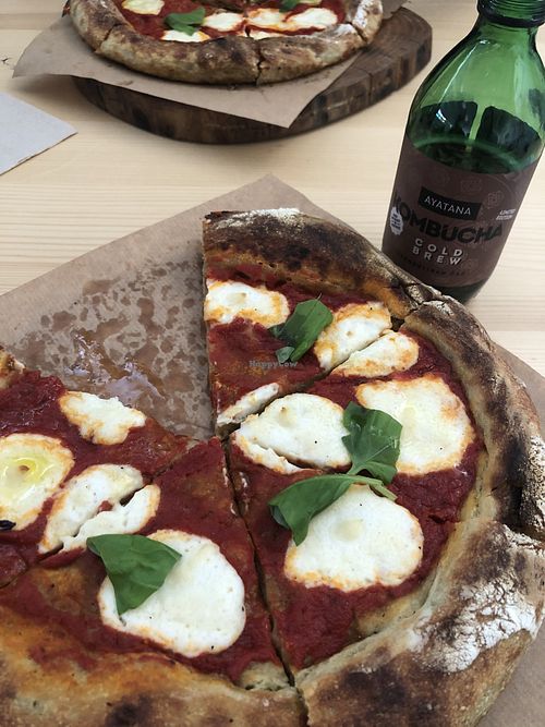 pizza marga and kombucha cold brew at Kucha in Ljubljana