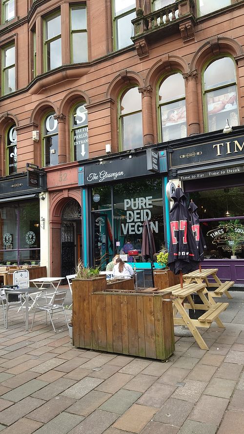 Facade with outdoor seating at The Glasvegan in Glasgow