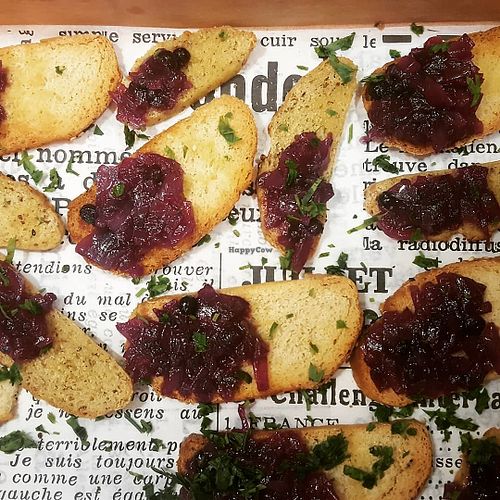 Complimentary toast with red onion and blueberry jam. at Matrjoska Kroshka in Budapest