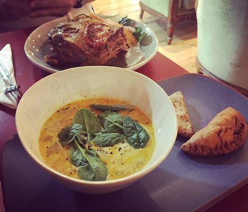 Goan soup, with gigantic lasagne portion in the background!  at Chickpea in Liverpool
